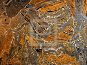 Крупноформатные панели Дюрамика с поверхностью из полудрагоценного камня Tiger Iron